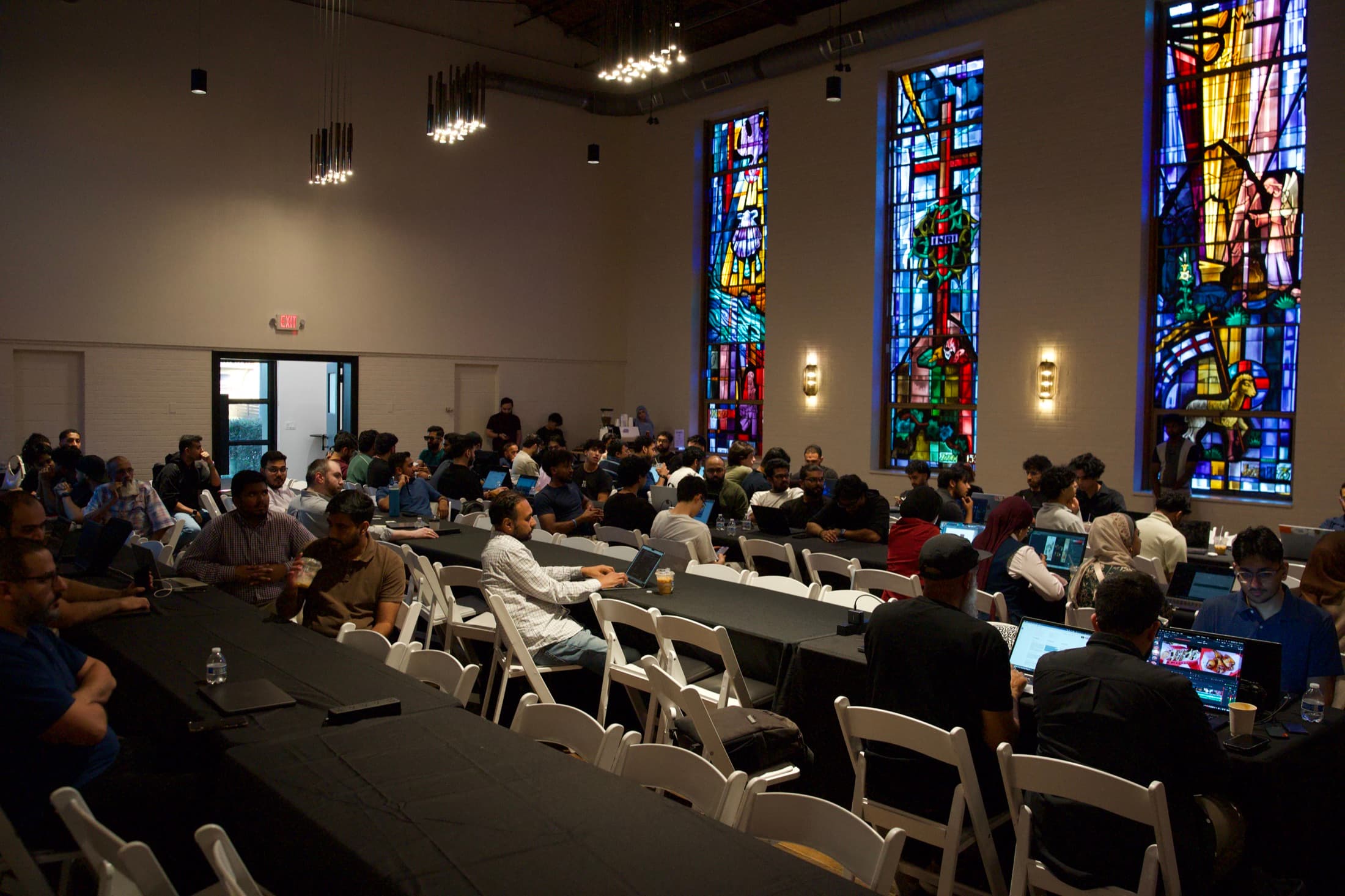 The hall at Chatelet Dallas, long tables full, Build Night Vol. 01